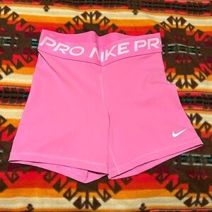 Pink Nike Pro 3” shorts, women’s size S